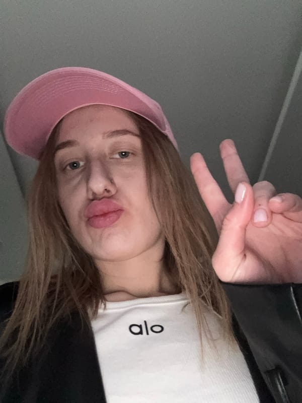 Woman takes selfie in pink cap in Rostov-on-Don