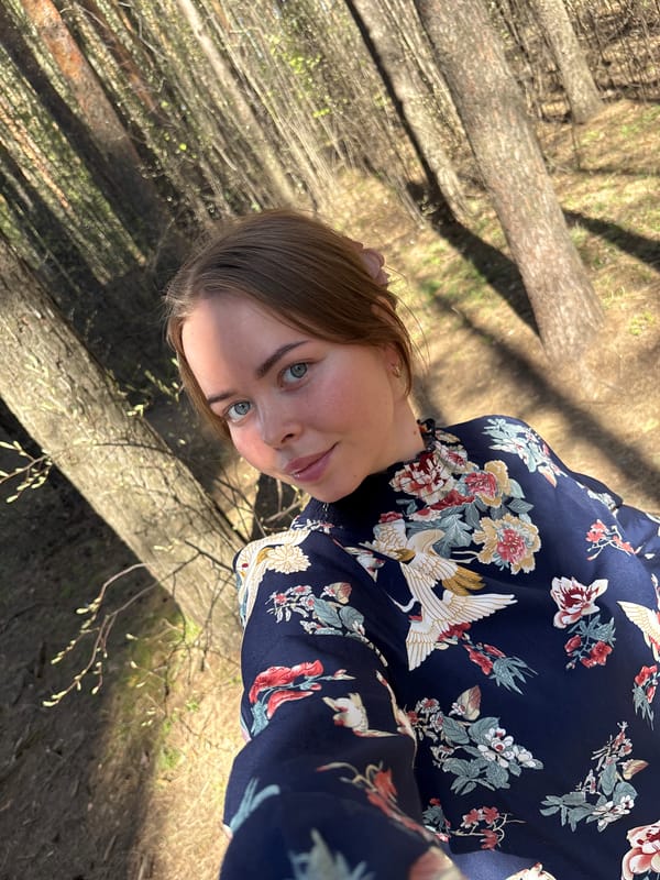 Woman takes selfie in spring forest in Izhevsk