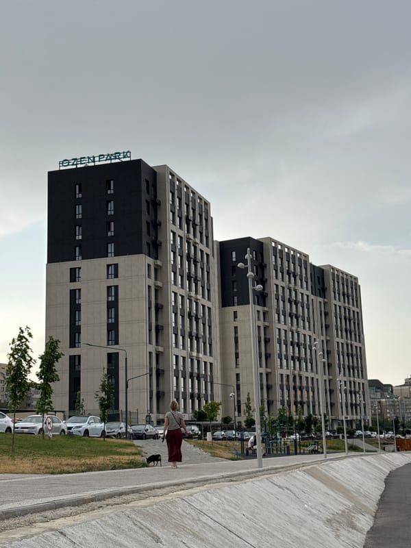 Modern Almaty residential complex with river channel and gardens