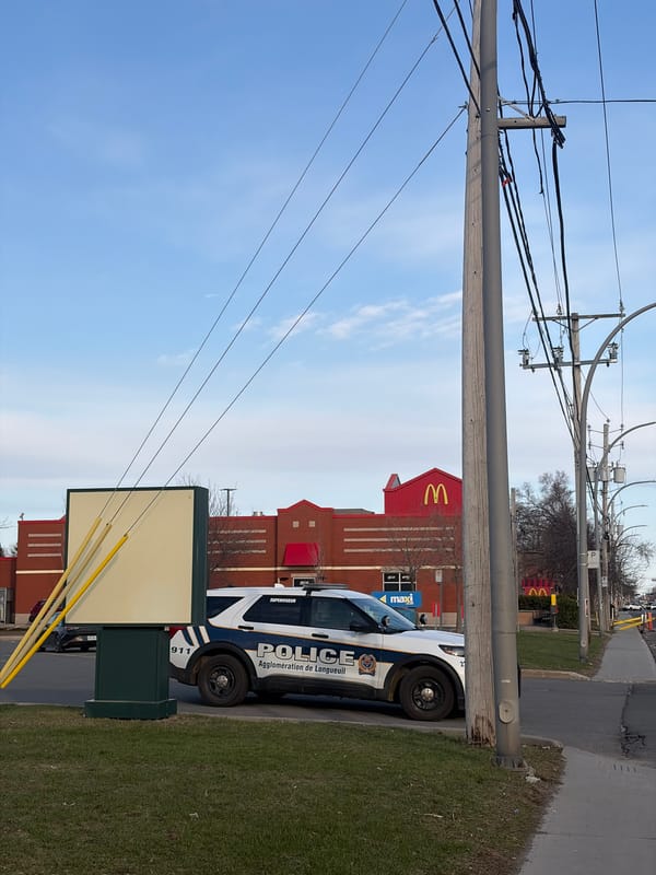 Street scene with police car captured in Longueuil