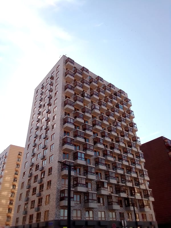 Early morning construction activity observed near urban residential buildings