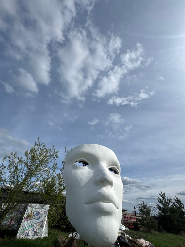 Visitor explores giant face sculpture at Nizhny Novgorod art installation