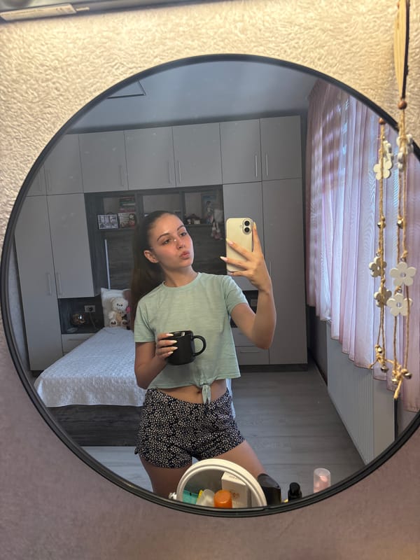 Young woman takes selfies at home in Bulgarovo, Bulgaria