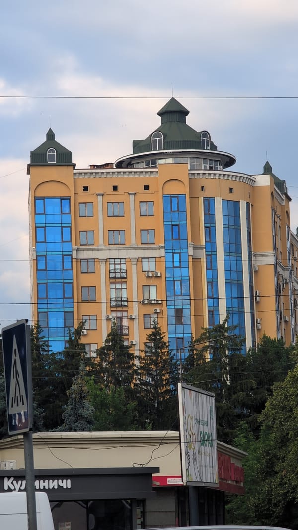 Poltava street scene near a landmark building on a cloudy afternoon