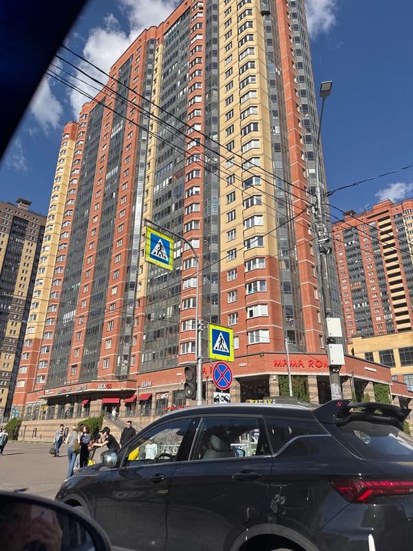Ordinary street life documented across Saint Petersburg during sunny afternoon
