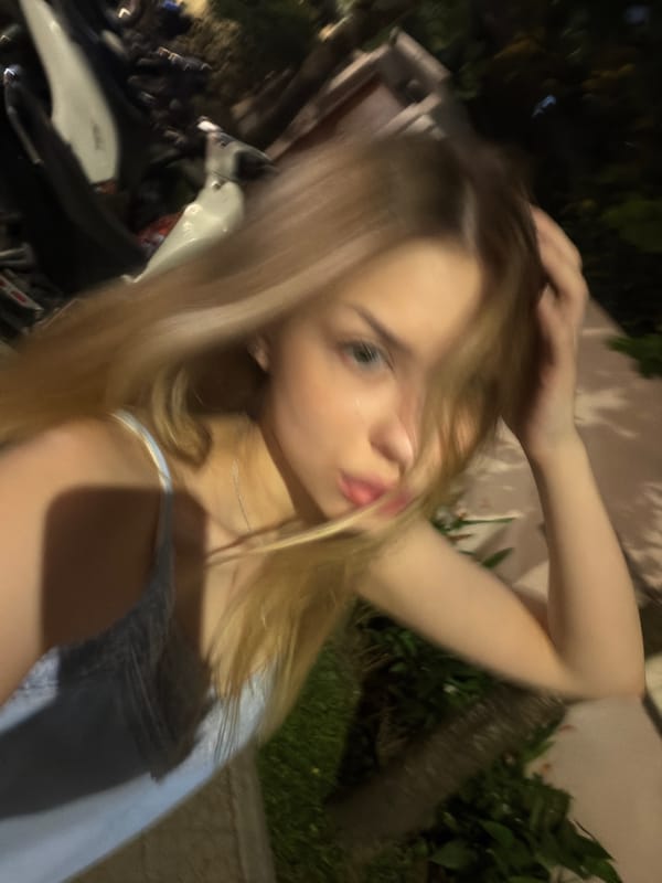 Night selfie taken near illuminated coffee cart in Đà Nẵng