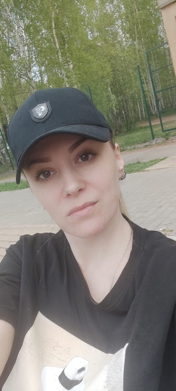 Woman in black cap, beach boardwalk captured simultaneously
