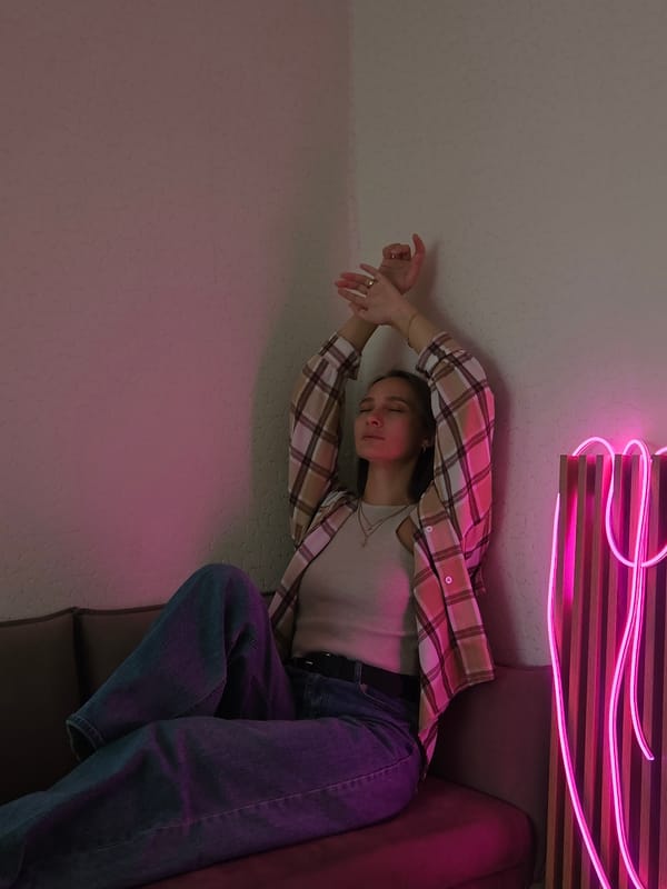 Woman photographed in various indoor poses in Chaikovsky, Russia