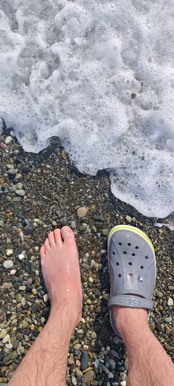 Beachgoers enjoy casual afternoon at Sochi pebble beach