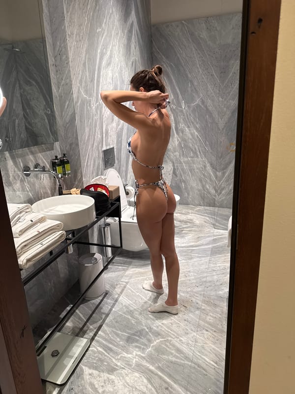 Woman documented in hotel rooms during afternoon activities
