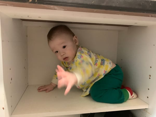 Baby crawls inside white cabinet in Izhevsk home