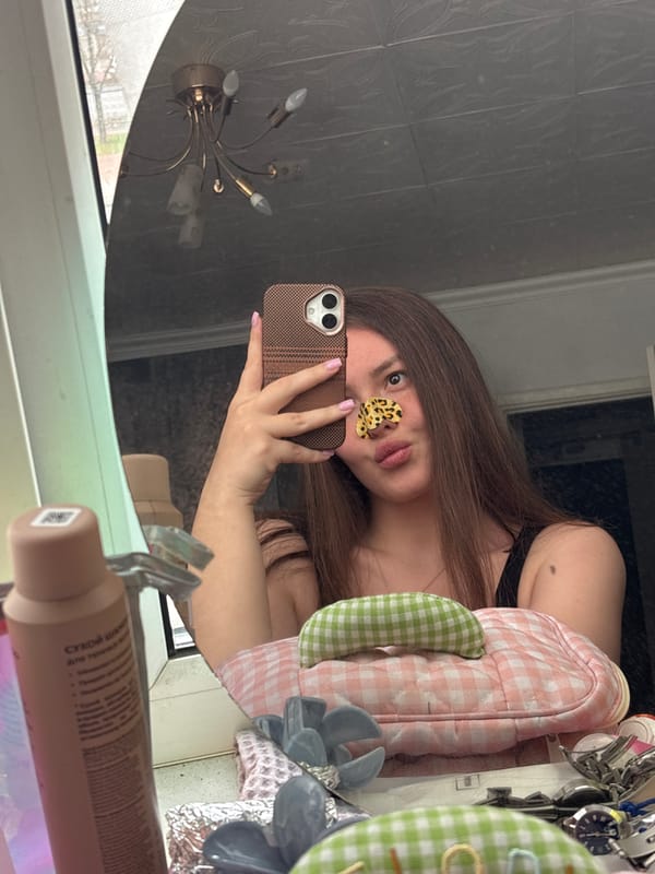 Woman takes mirror selfie with butterfly sticker in Saint Petersburg