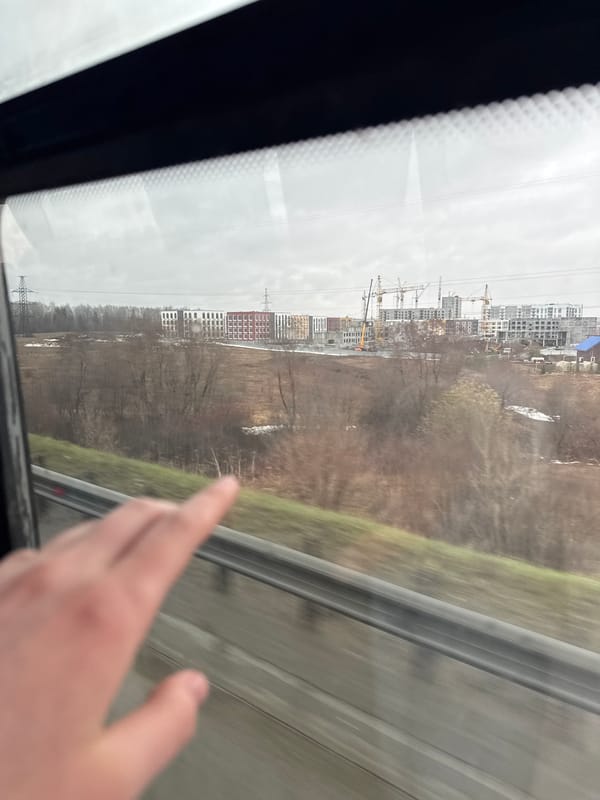 Train passenger documents construction and cityscape views in Froly