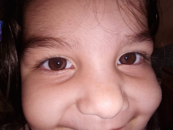Close-up portraits of children captured in unknown location
