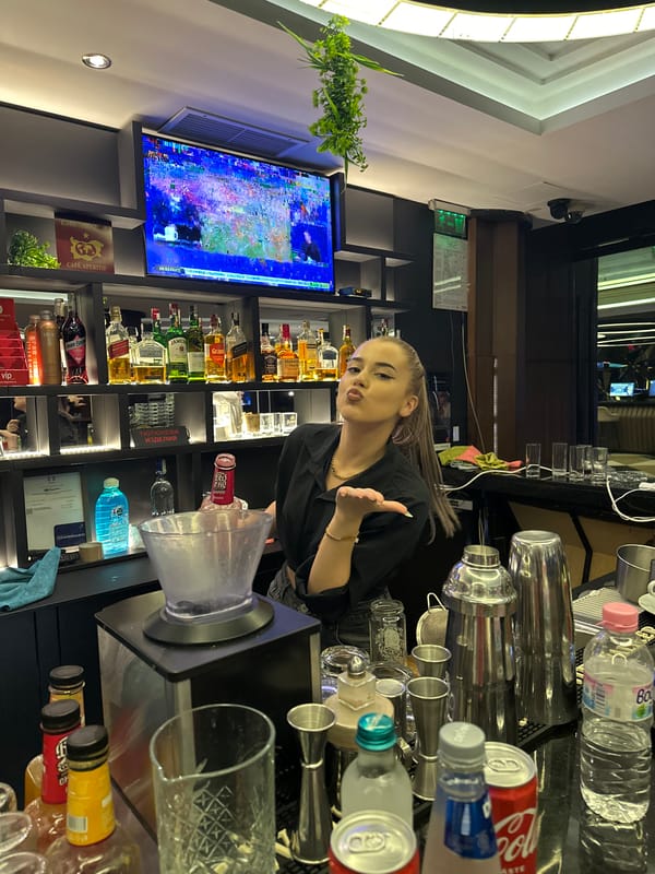 Bar staff prepping drinks during an evening shift at a branded venue