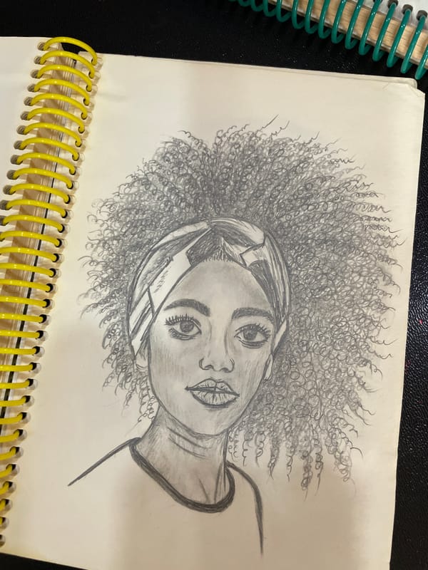 Pencil portrait sketches filling a spiral notebook in Bishkek