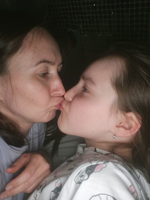 Mother and daughter share bedtime moment in Krasnogorskoye