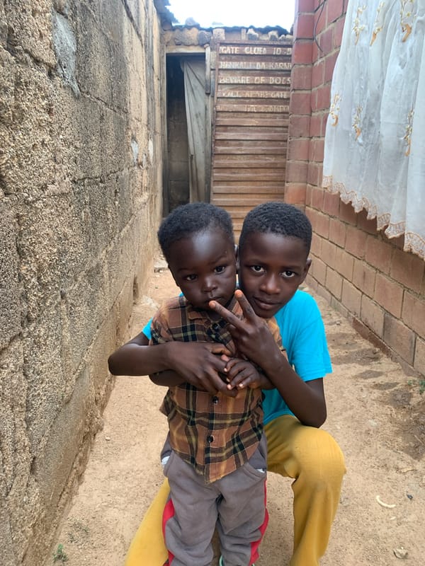 Daily life unfolds on Jos streets: children, vendors, residents