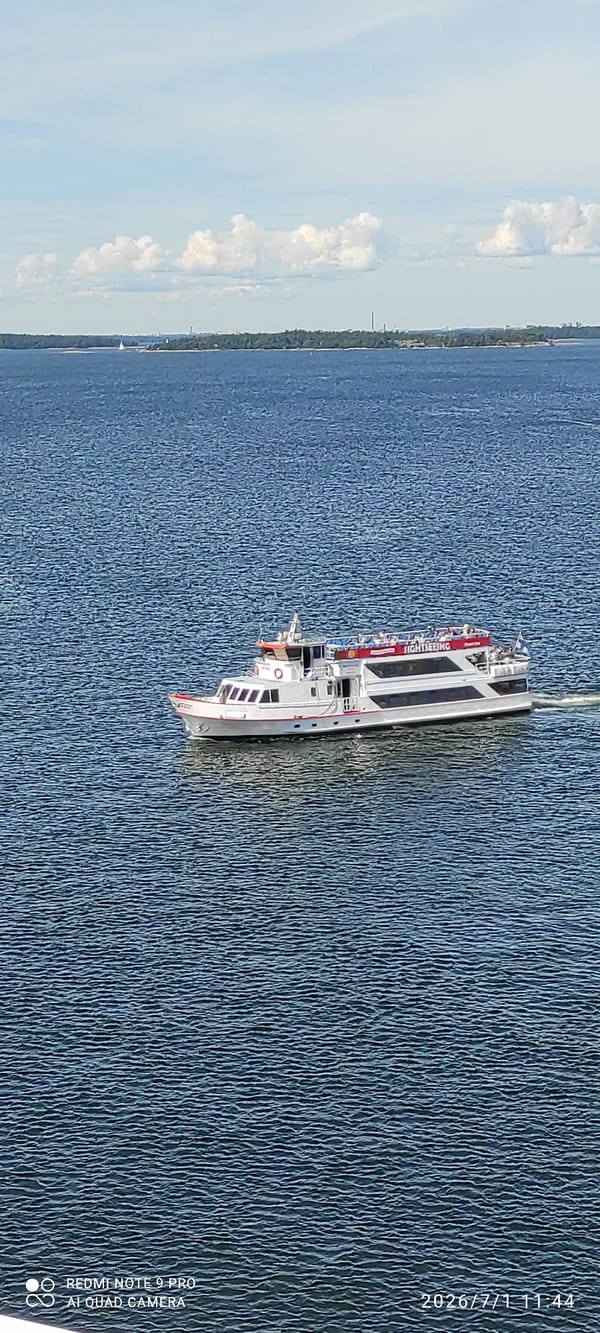 Ferry and sightseeing boat navigate Helsinki's coastal waters