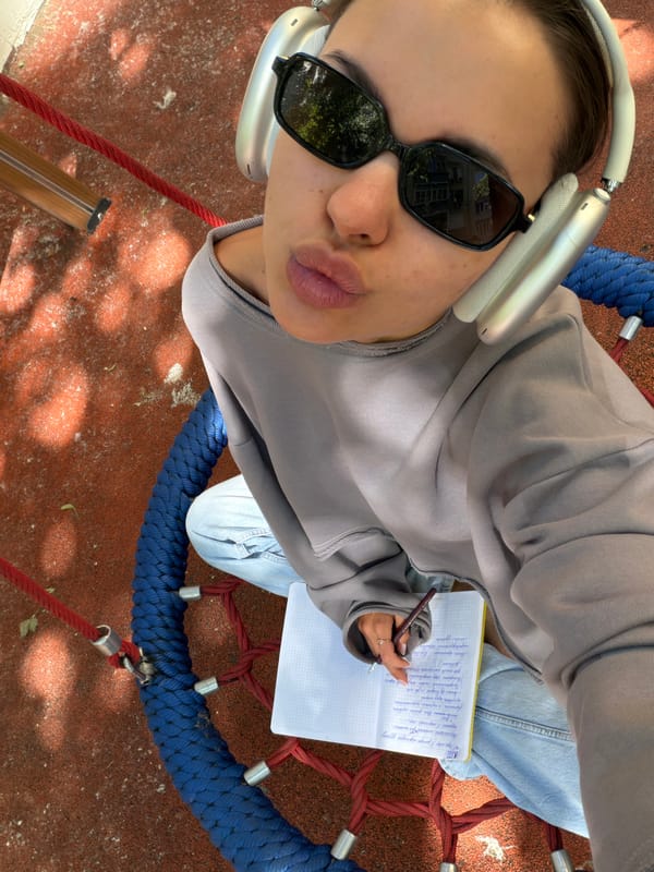 Woman takes playground selfie on net swing in Moscow