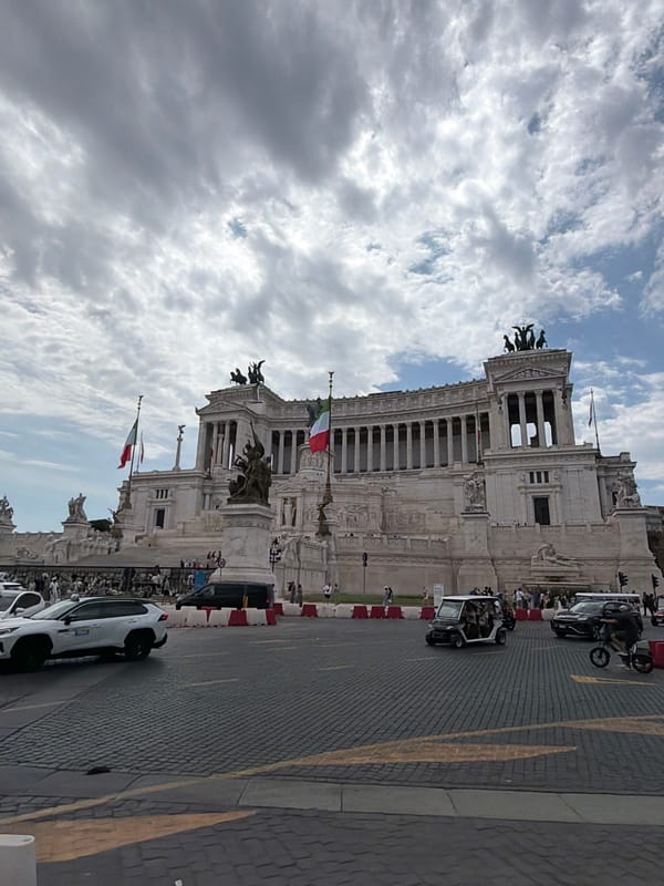 Tourist documents Rome's historic monuments during morning walking tour