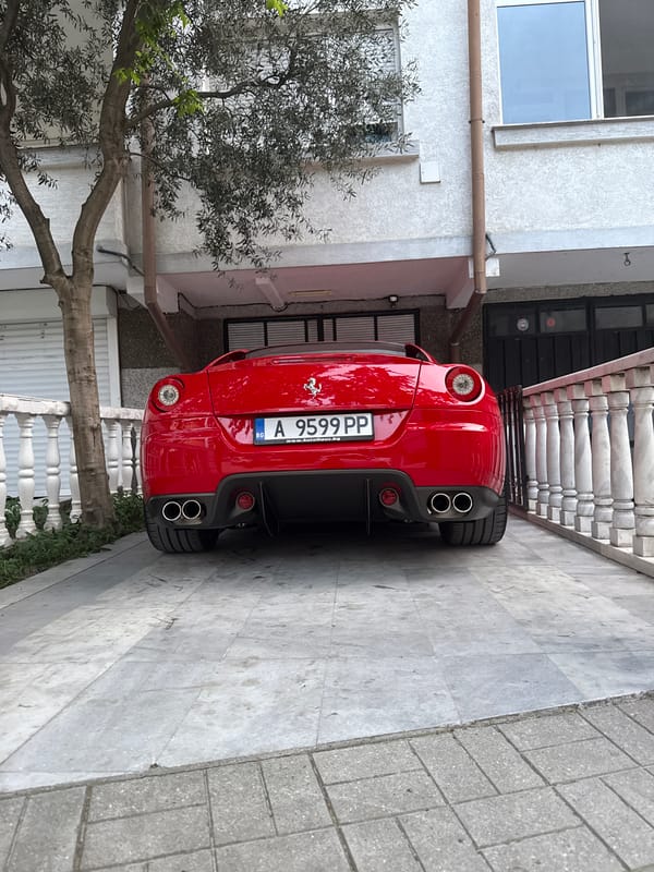 Red Ferrari 599 GTB documented parked in residential area