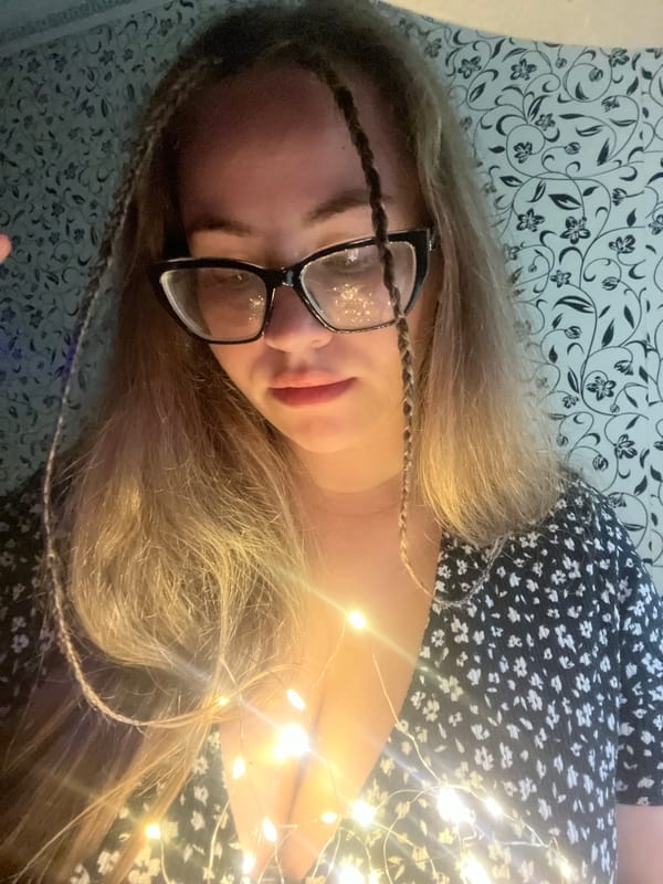 Woman poses with fairy lights in casual photo session