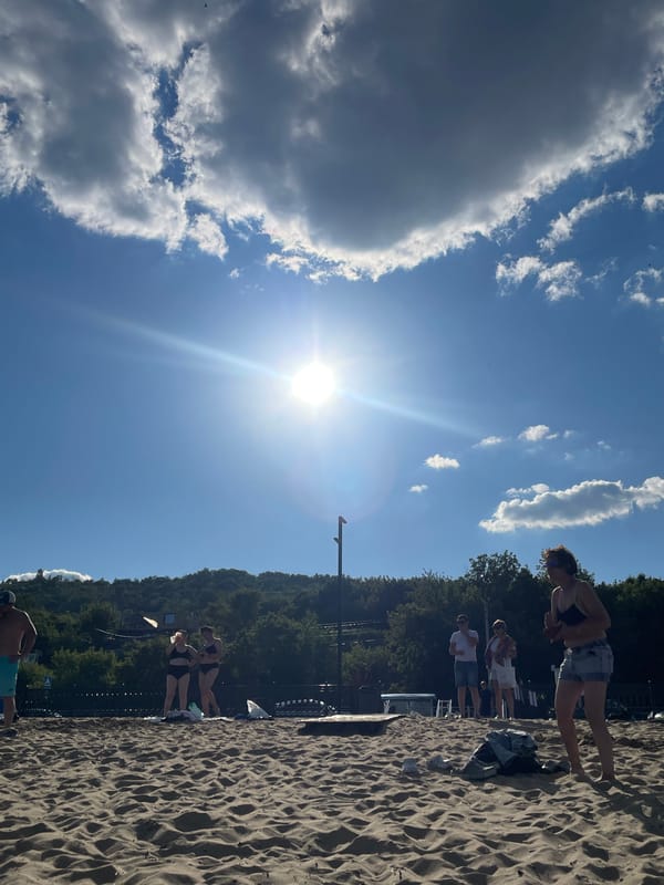 Packed Volga beach day in Saratov on a hot July afternoon