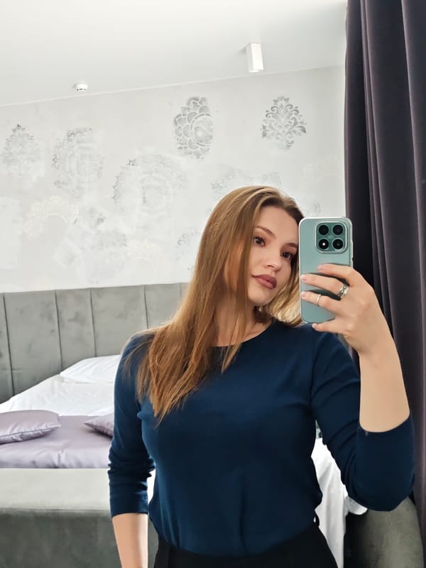 Woman takes mirror selfies in Chernivtsi bedroom