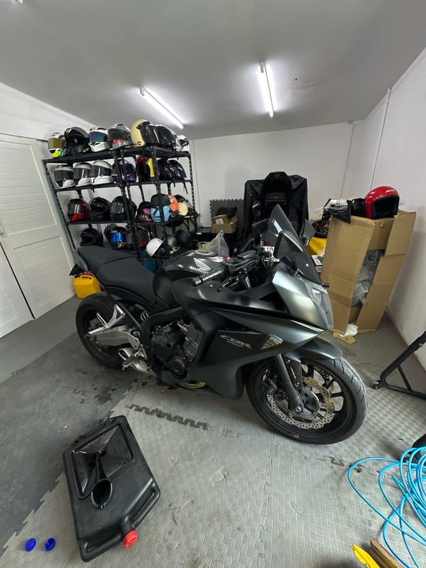 Motorcycles and gear at a Karon storage spot, early morning