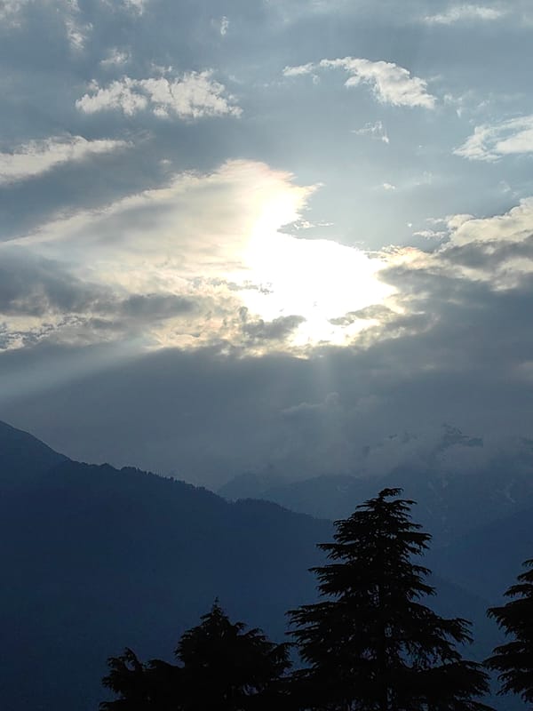 Mountain landscapes and dramatic skies above Prini, Himachal Pradesh