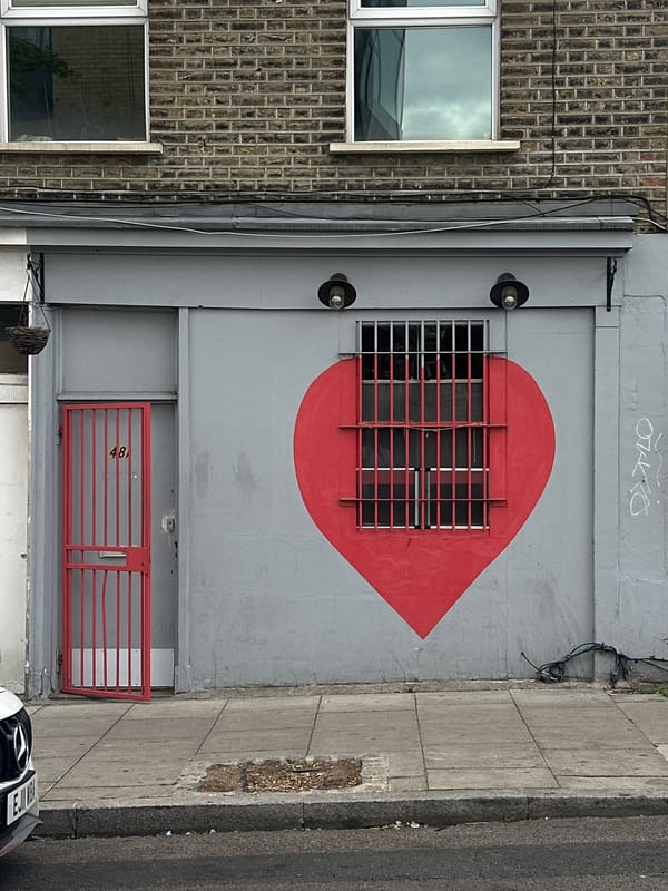 Red heart street art spotted on London building wall