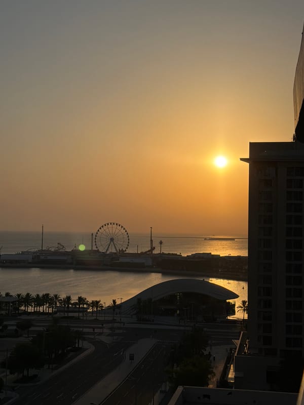 Golden sunset hits Lusail's waterfront pier and Ferris wheel