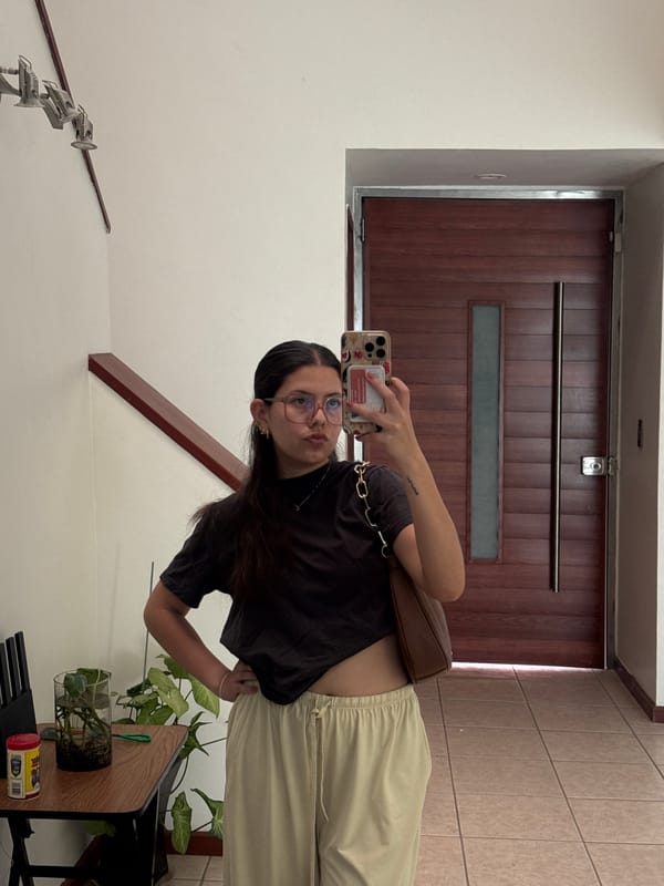 Woman takes selfies indoors in Puebla, Mexico