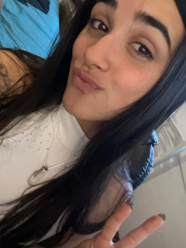 Woman takes peace sign selfie in Buenos Aires