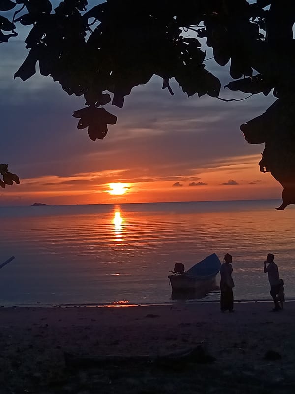 Three silhouettes witnessed on Thai beach during daylight water reflection