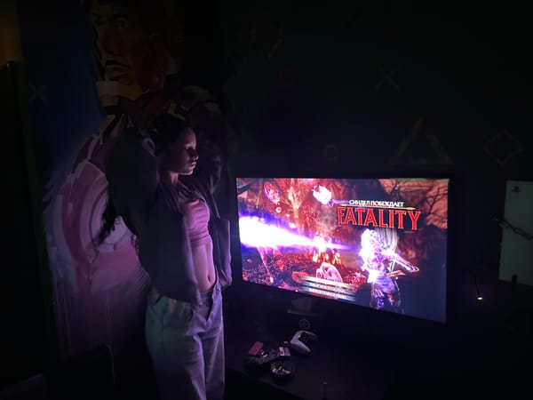 Person hangs upside down while playing Mortal Kombat in Yerevan