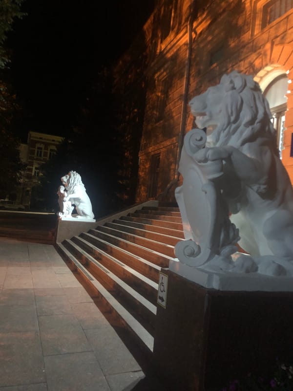 Night stroll past Chernivtsi's theater and lion sculptures