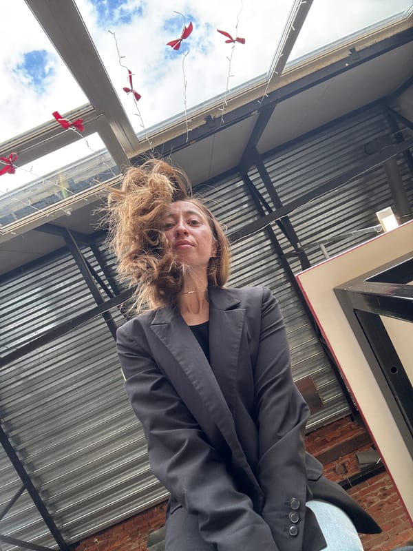 Woman photographed from low angles in Chaikovsky cafe interior