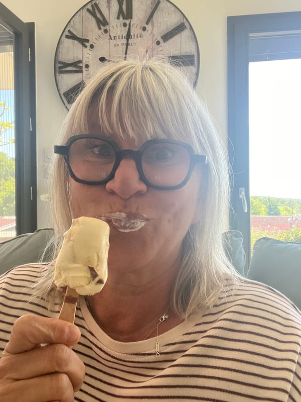 Woman enjoys food tour, takes selfie in French village