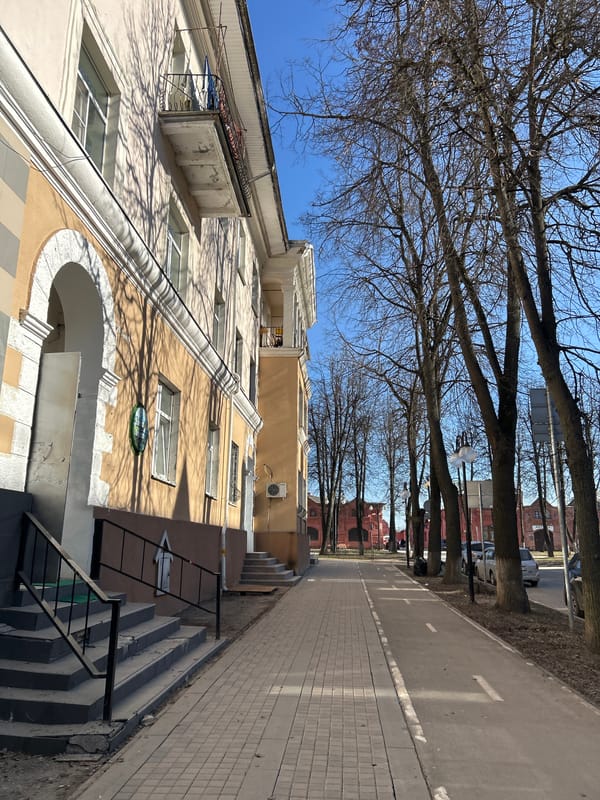 Woman photographs herself on street in Klin, Russia