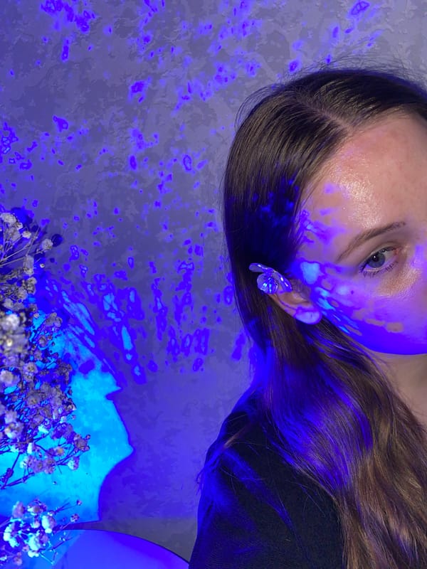 Person takes selfies under colored lighting in Izhevsk