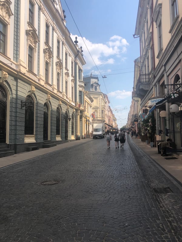 Strolling Chernivtsi's historic pedestrian center on a summer afternoon