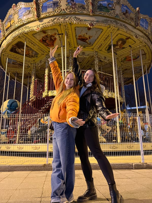 Friends enjoy evening at illuminated amusement park in Tyumen
