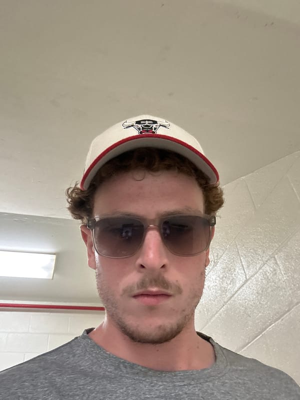 Person relaxes poolside at Aventura resort