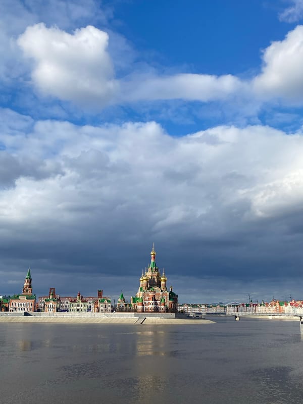 Tourist documents Yoshkar-Ola landmarks during afternoon city walk