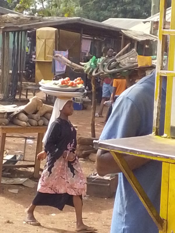 Women conduct daily activities in Tamale market area