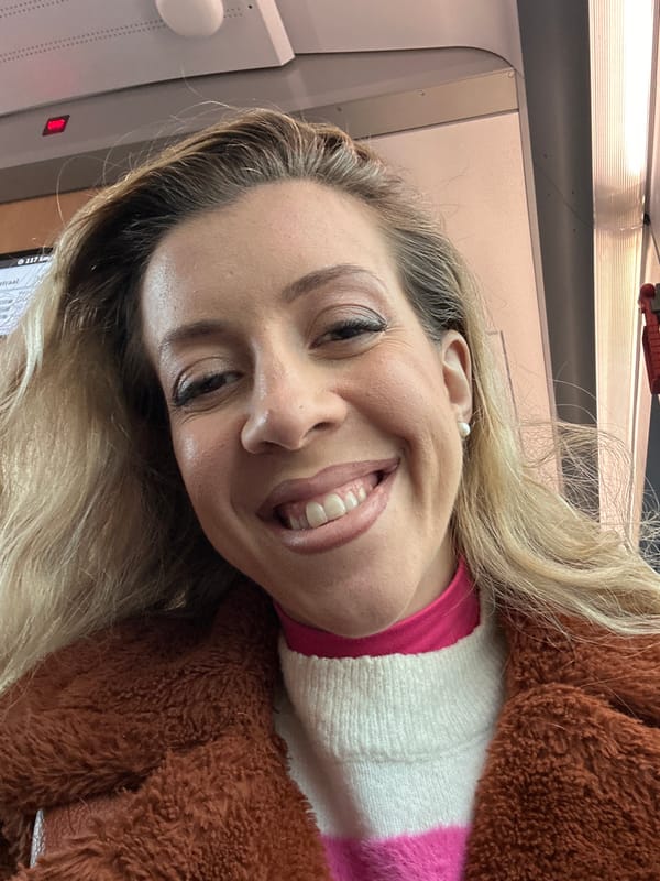 Woman photographed smiling on Amsterdam train