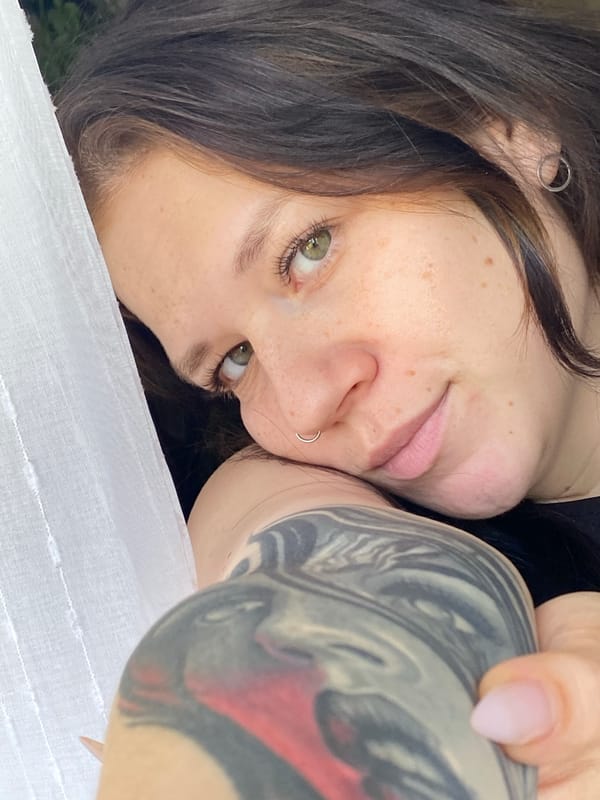 Morning photography session captures woman, plant, cat in Chaikovsky
