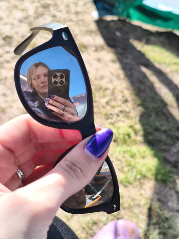 Woman takes selfies during outdoor morning activity in Russian village